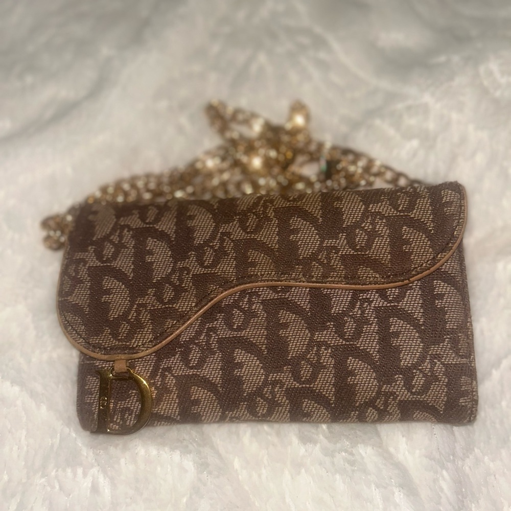Brown Dior Monogrammed saddled wallet